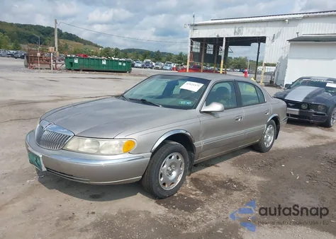 1999 Lincoln Continental из США, поврежденный, VIN 1LNHM97V2XY629957